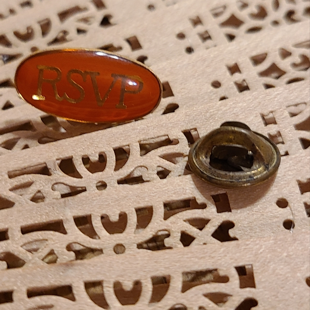 RSVP tie tack pin.
